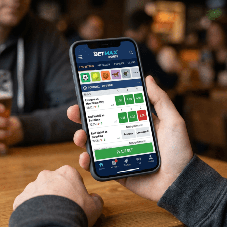 Sports betting app showing live football match scores and betting odds